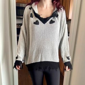 A size medium distressed sweater from POL